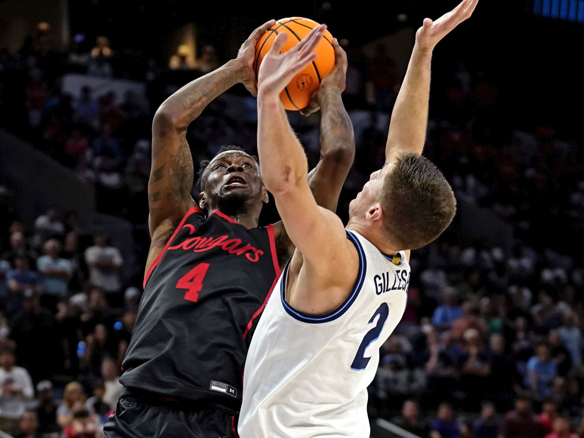 Houston Cougars guard Taze Moore (4) shoots the ball against Villanova Wildcats guard Collin Gillespie (2) during the second half.